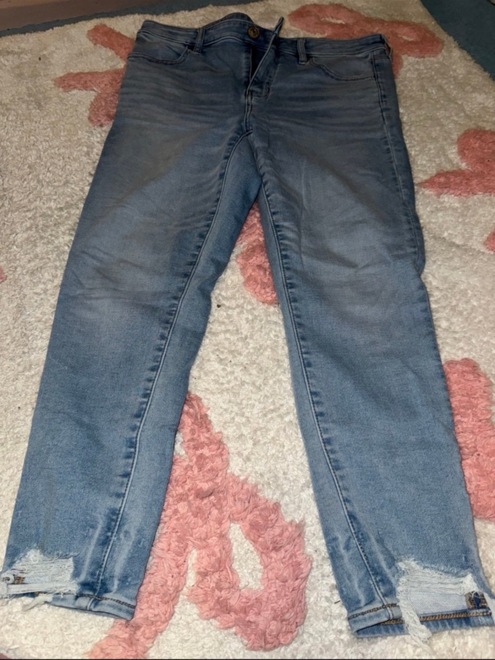 American Eagle Outfitters Light Blue Skinny Jeans with Distressed Hem